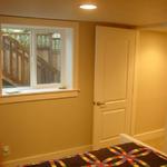 Larger windows were cut into the concrete for both bed rooms to satisfy egress requirements.