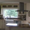 A larger window was installed in Scott and Wally's new kitchen.  The new tile floor in the kitchen is also heated.  Coco the dog "simply loves it".